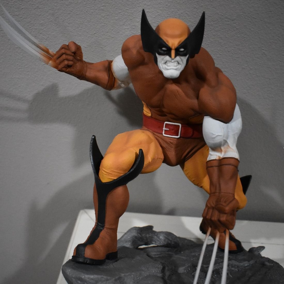 3D printed piece by WePrint3D - Comic-style figure - flat colour blocking - rock base